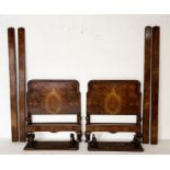 A pair of antique walnut veneered single beds with labels to headboards for G.Jetley, 52 South