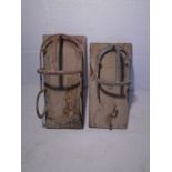 Two vintage bridle hooks and a saddle rack.