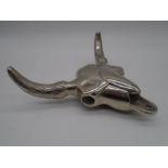 A decorative wall hanging metal cattle skull, width of horns 25.5cm