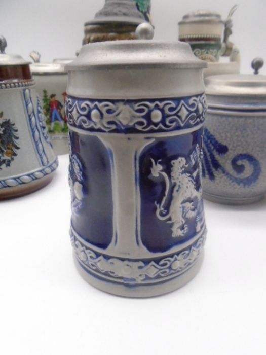 A collection of twelve Steins. - Image 5 of 21