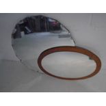 A round Art Deco mirror along with a mid-century wall mirror