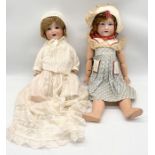 Two large Armand Marseille bisque headed dolls with sleeping eyes - height 49cm and 51cm