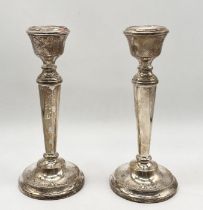 A pair of hallmarked silver candlesticks, height 15.5cm
