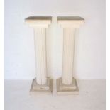 A pair of painted wooden columns, height 102cm.
