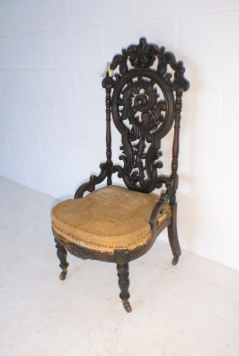 A Victorian nursing chair, with carved Black Forest style decoration to back - in need of - Image 2 of 4