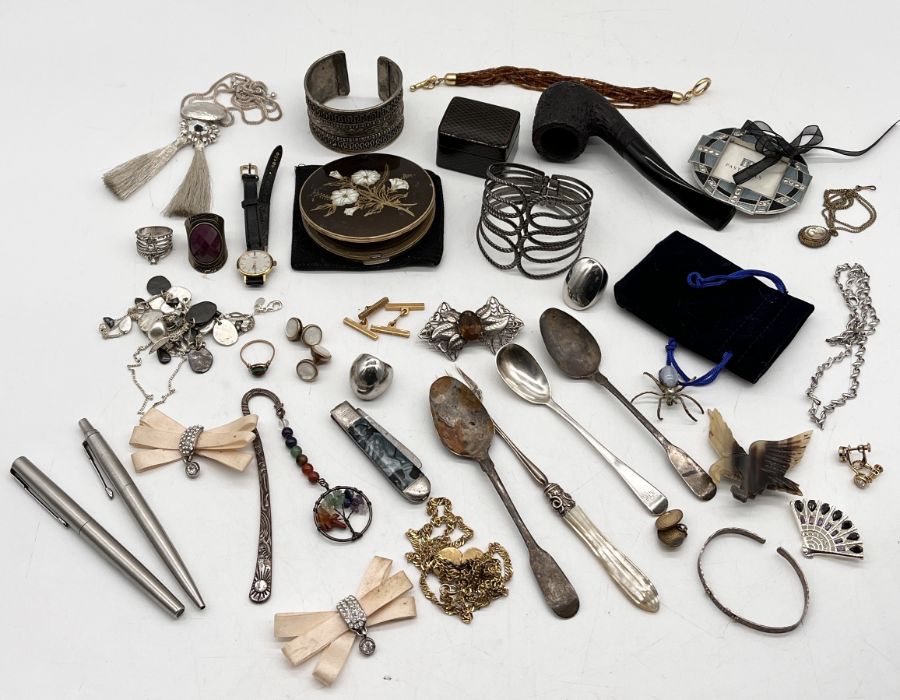 A collection of costume jewellery, silver spoons, pipe etc