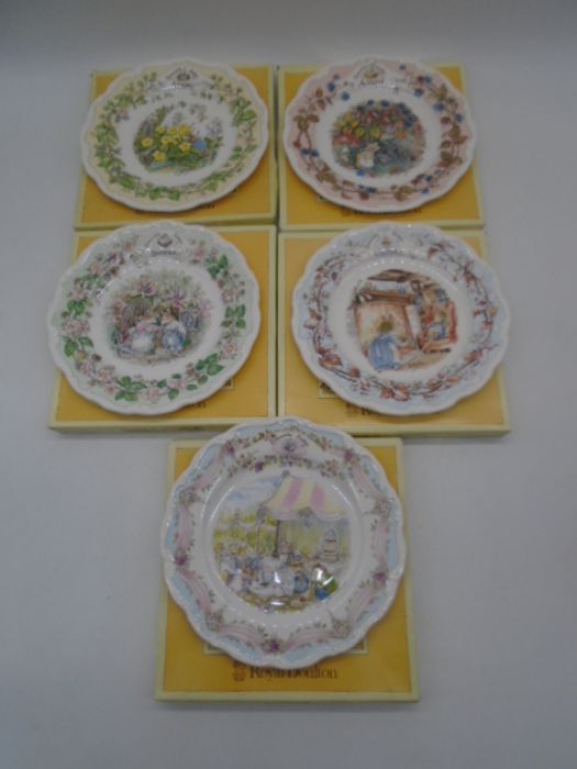 A set of Royal Doulton Brambly Hedge "Four Seasons" plates, along with "The Wedding" Brambly Hedge