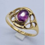 An 18ct gold ring set with a ruby (approx. 6mm x 4mm)