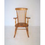 An elm stick-back rocking chair.