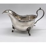 A hallmarked silver Walker & Hall gravy boat, weight 156.4g