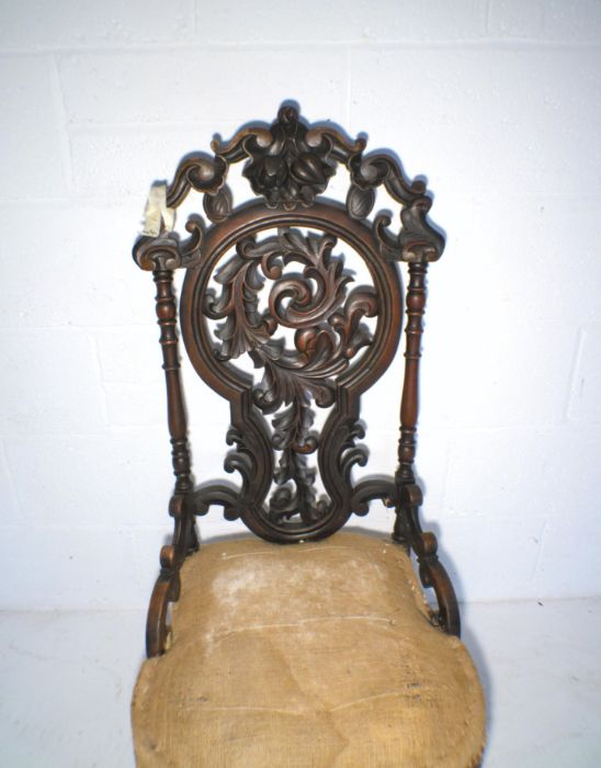 A Victorian nursing chair, with carved Black Forest style decoration to back - in need of - Image 4 of 4