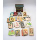 A collection of vintage playing cards including Disney, Beatrix Potter, Happy Families etc, along