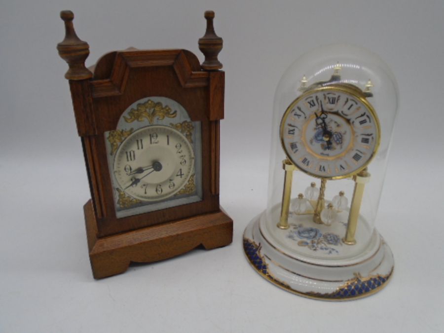 An anniversary clock on porcelain base along with a and mantle clock with silvered dial