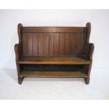 A pitch pine church pew, length 115cm, height 97cm.