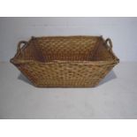 A vintage wicker basket - length 82cm, height 38cm
