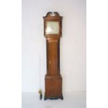 An oak longcase clock with painted dial named to 'W. Gunnell, Newbury'.