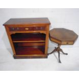 A reproduction yew wood bookcase and octagonal drum table with draw.
