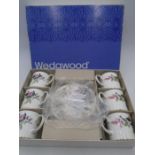 A boxed part set of Wedgwood "Hathaway Rose" tea cups and saucers (one saucer missing, one cup