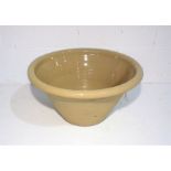 A large terracotta glazed cream bowl, diameter 50cm.