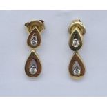 A pair of 9ct gold earrings set with diamonds