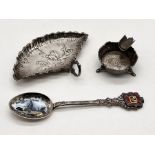 A small hallmarked silver fan shaped dish along with an ashtray with 1861 1000 Reis coin imbedded