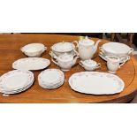 A Johann Haviland part dinner service with floral pattern including large teapot, dinner plates,