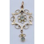 An Art Nouveau pendant set in 9ct gold with aquamarines