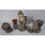 An assortment of garden ornaments in the form of animals including a Fox and an Otter, plus a