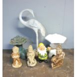 A quantity of garden ornaments including a metal crane, four gnomes and two Pagodas.