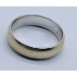 An 18ct gold wedding band, weight 8.3g