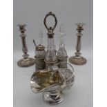 A pair of silver plated candlesticks, condiment set and scuttle shaped sugar