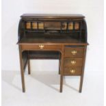 A ladies roll top desk with four drawers under, A/F.