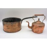 A large copper pan and a copper kettle.