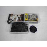 A collection of various OO gauge model railway accessories including a locomotive, wagons,