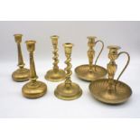 Three pairs of brass candlesticks.