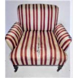 A Victorian armchair on turned legs. One castor A/F