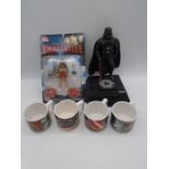 A Thinkway Toys Darth Vader toy, along with four Star Wars "The Force Awakens" mugs and DC Direct
