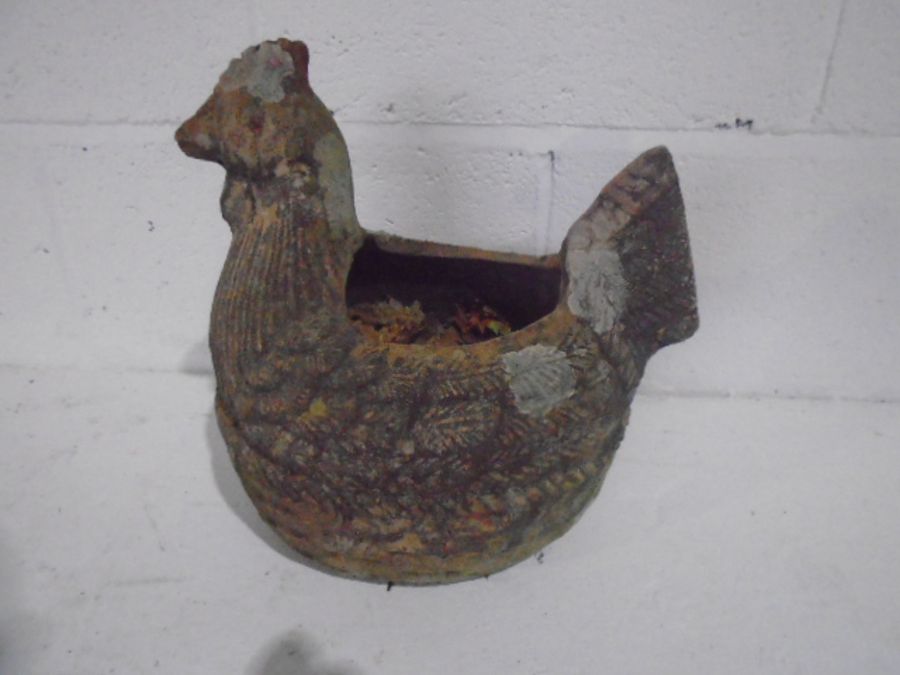 A weathered terracotta planter in the form of a chicken, length 33cm