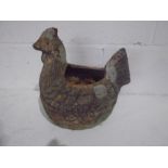 A weathered terracotta planter in the form of a chicken, length 33cm