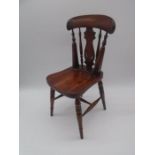 A miniature child's mahogany chair - height 47cm