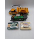 An unboxed remote-controlled Volvo A40G Articulated Hauler, along with a tinplate Great Western
