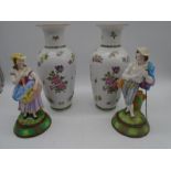 A pair of continental porcelain vases along with a pair of Edwardian bisque figures