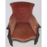 A French Napoleon III armchair with serpentine front and button back.