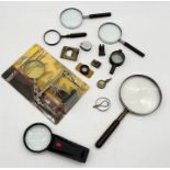 A collection of various magnifying glasses, viewers etc