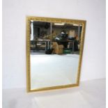 A gilt framed rectangular wall mirror, marked 'Morris Mirrors', 129cm x 100cm.