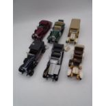 A collection of Franklin Mint die-cast precision models including a1932 Cadillac V-16 Sport Phaeton,
