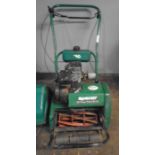 A Qualcast 35s petrol cylinder lawn mower.