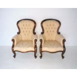 A pair of 'Cachet' Victorian style mahogany framed armchairs, with button-back detailing and