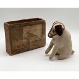 An early 20th century velvet seated dog, likely Steiff but with no button to ear, glass eyes and