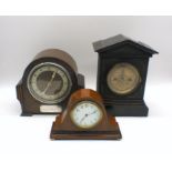 Three mantel clocks.